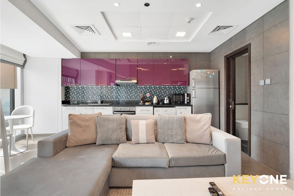 Deluxe Apartment, Sea View | Living area | TV