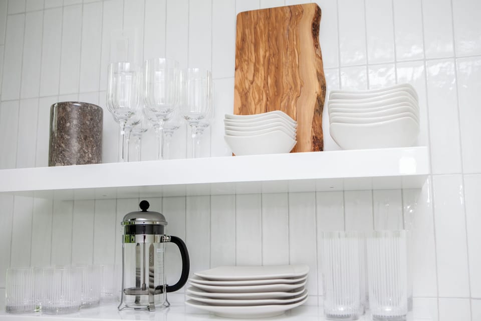 Dishware and glassware located in the kitchen.