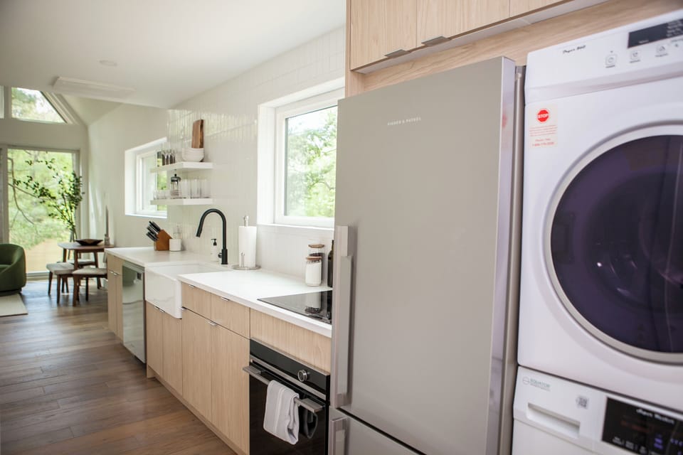 Kitchen interior with washer and dryer.