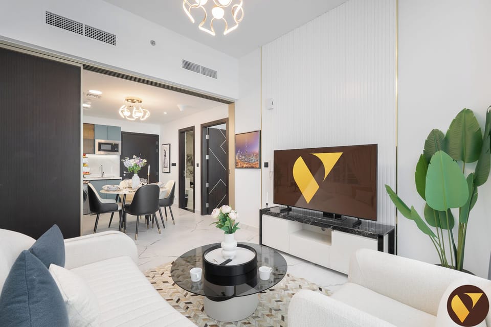 Luxury Apartment, Balcony, City View | Living area | 65-inch Smart TV with satellite channels