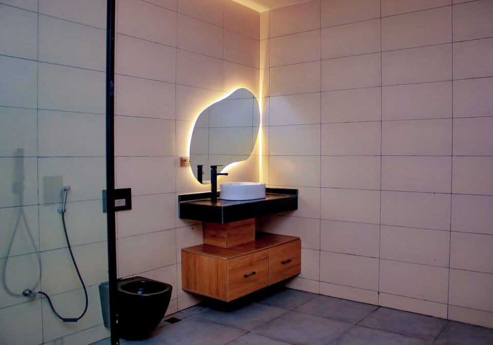 Luxury Suite, Balcony, Pool View | Bathroom | Shower, bathrobes, slippers, bidet