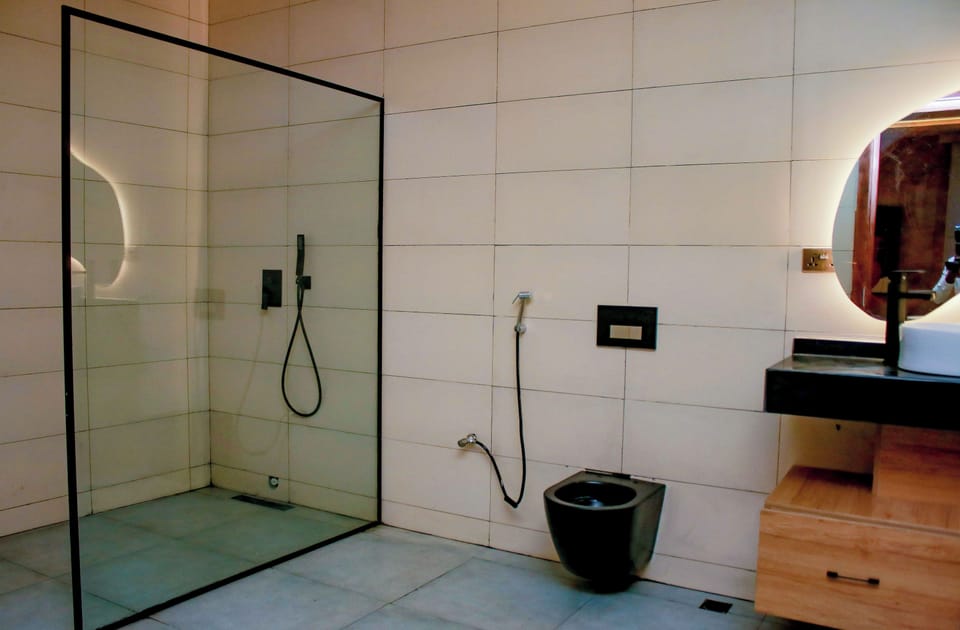 Luxury Suite, Balcony, Pool View | Bathroom | Shower, bathrobes, slippers, bidet