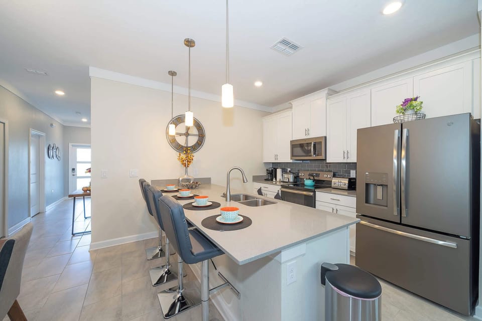 Modern kitchen with a large island and stainless steel appliances