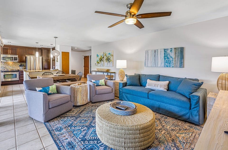 Spacious living room with plush seating and a cozy vibe, perfect for relaxing after a day at the beach.