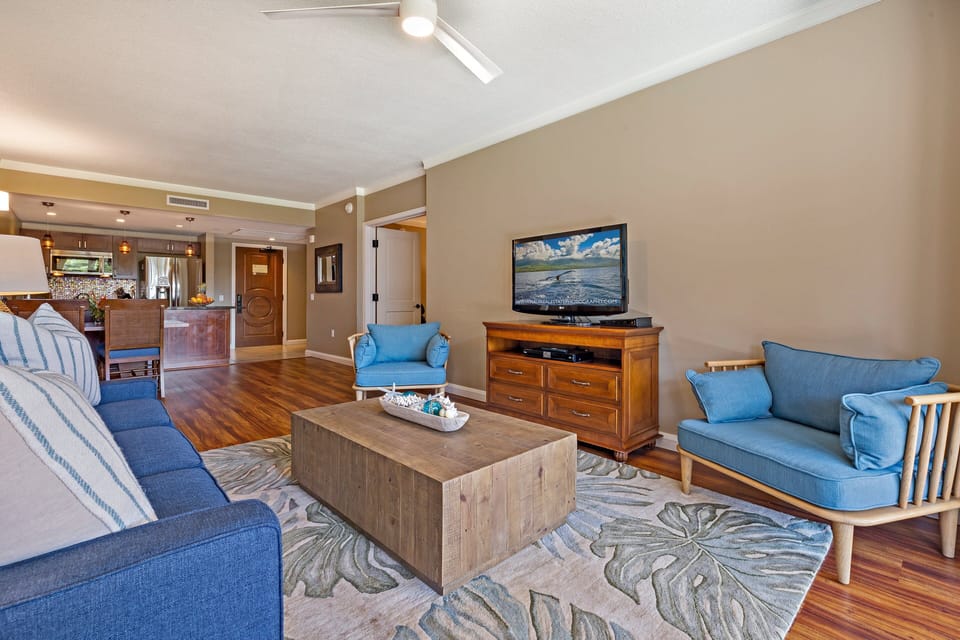 Take in the seamless open layout connecting the living room and dining area, creating a warm and inviting atmosphere