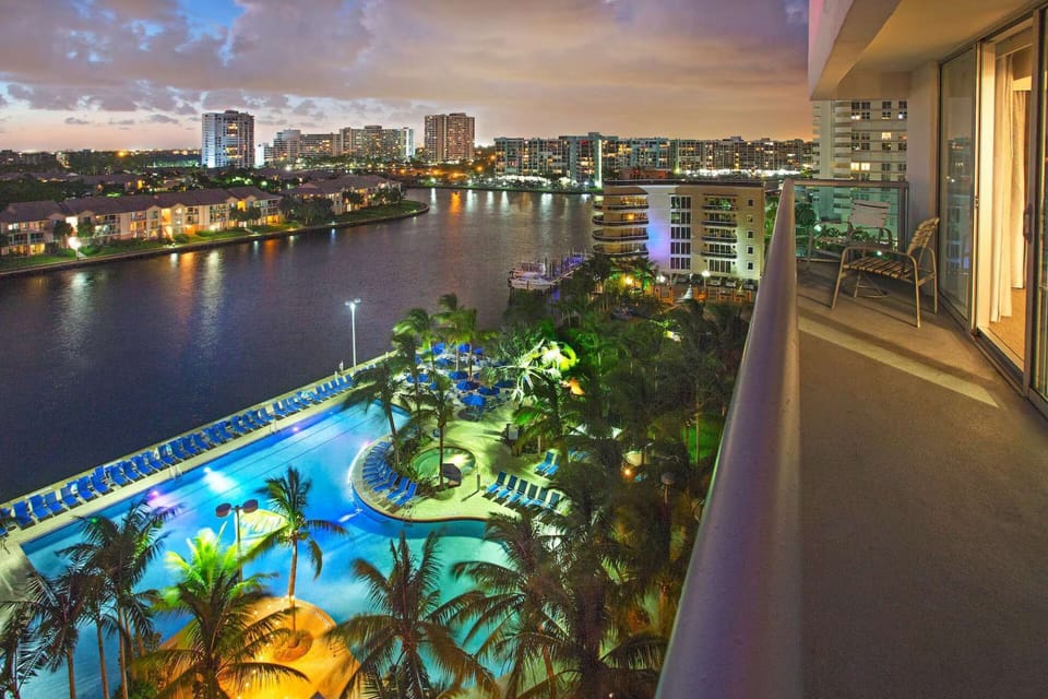 Balcony overlooking waterways, skylines views, and pool view.