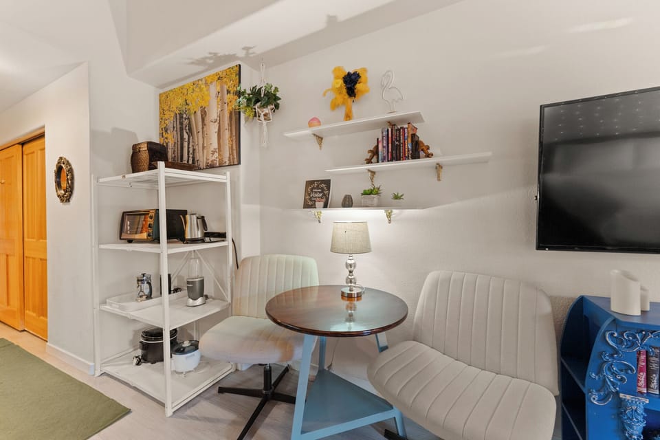 Cozy up in your stylish living space with curated shelving, comfortable seating, and thoughtful touches that make relaxation effortless.