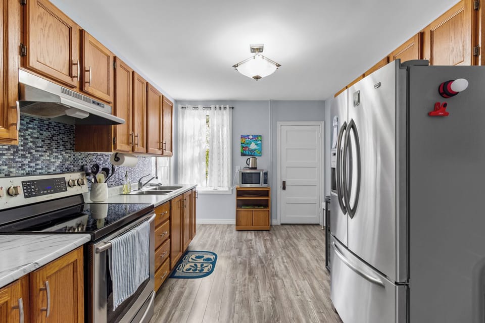 Fully equipped kitchen with modern appliances—perfect for home-cooked meals.