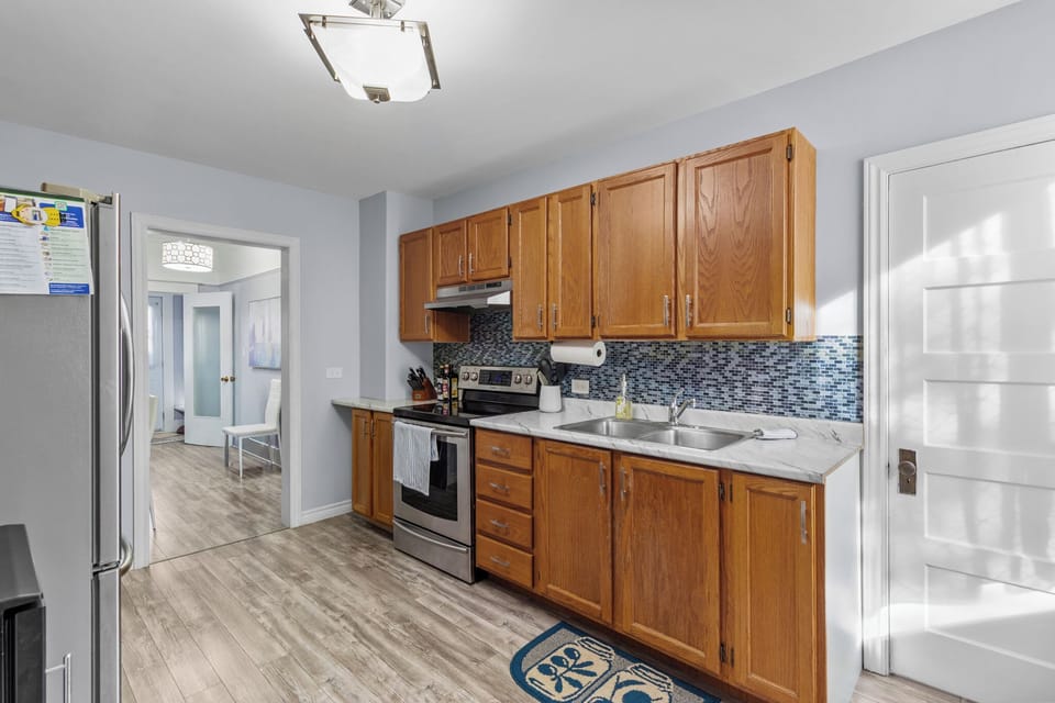 Warm and functional kitchen with wooden cabinetry and all essentials for a comfortable stay.