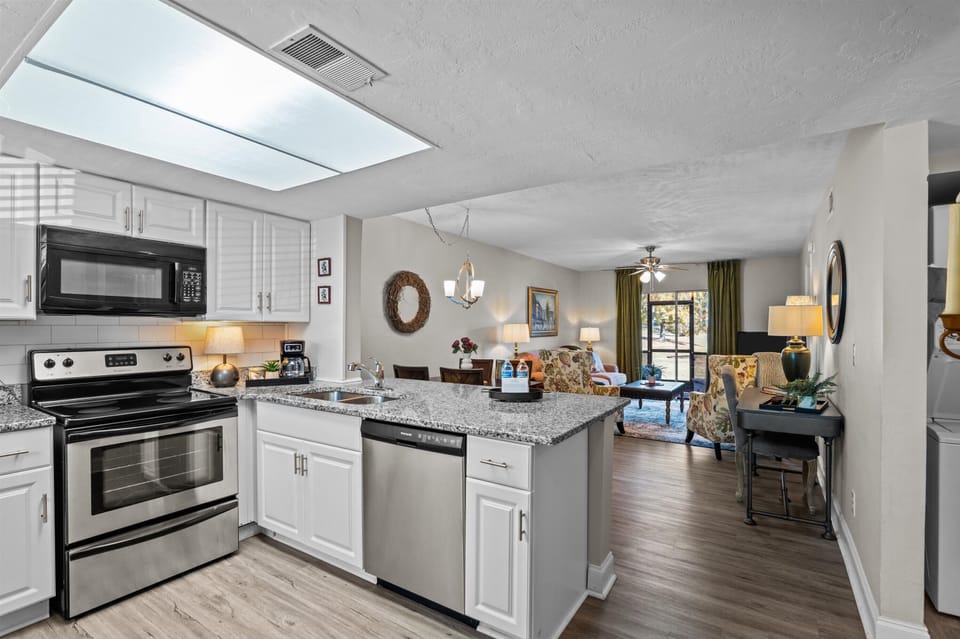 open-concept kitchen, dining, and living space