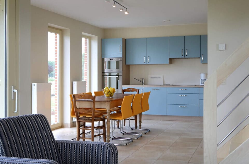 Kitchen with dinner table and dining area