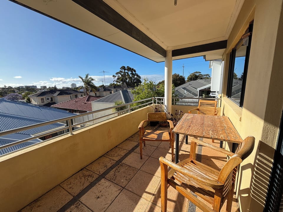 Balcony off kitchen lovely space to relax with morning coffee or a  sunset beverage of choice. 