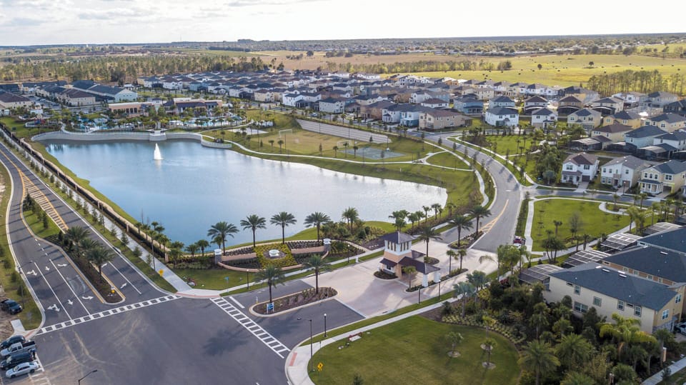 Discover a lively lakeside community with lush palm trees and serene views. This welcoming neighborhood offers modern homes and open green spaces ideal for leisurely strolls and enjoying nature, all close to local attractions.