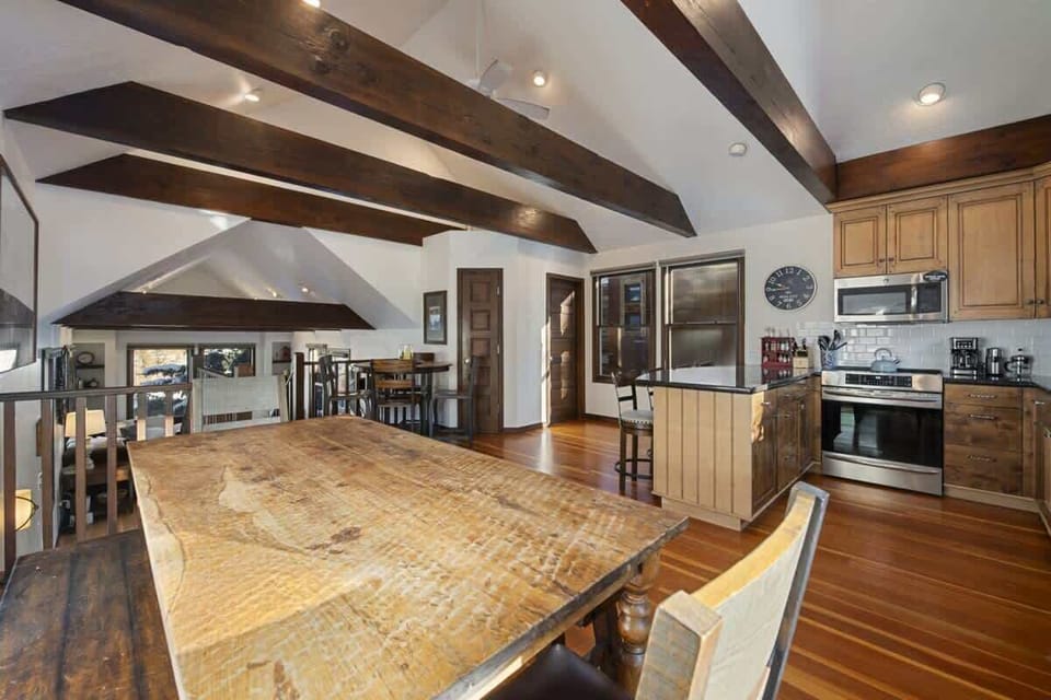 View of kitchen, dining and tall ceilings