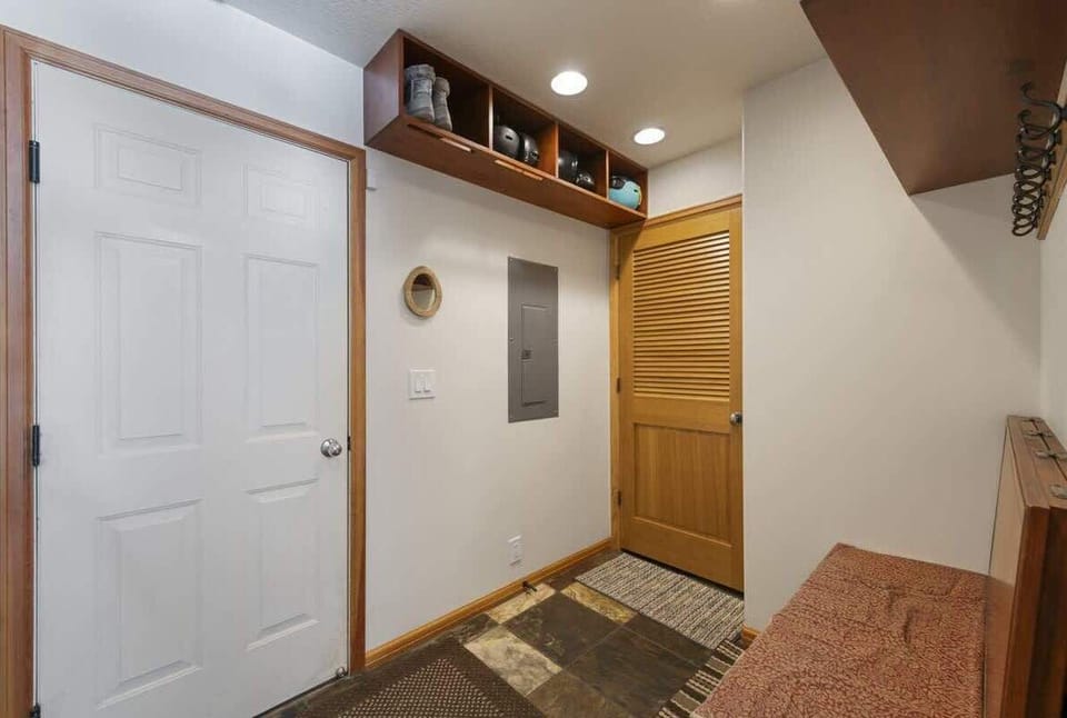 Mudroom with storage and garage access