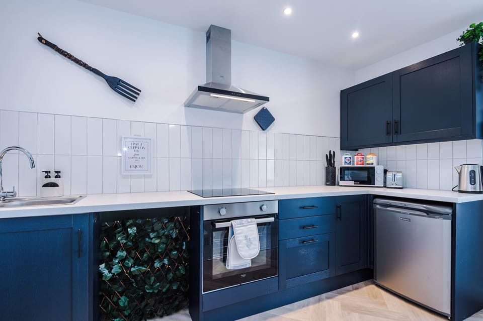 Fully equipped modern kitchen with everything you need for a comfortable stay. Included a washer/dryer.