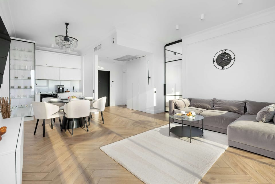 Stylish living and dining area with contemporary furniture and designer lighting.