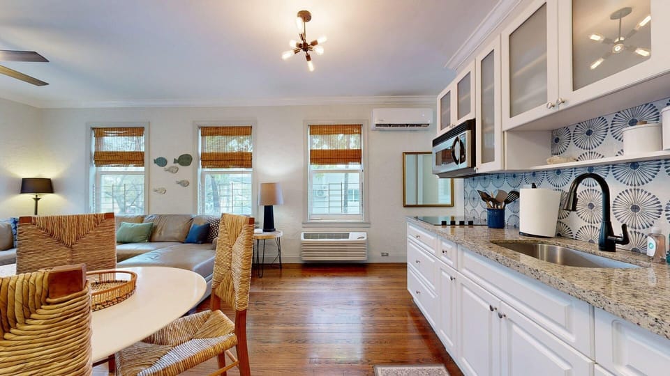 Living Area, Smart TV, Dining, Kitchen, Windows overlooking Washington Ave and Courtyard