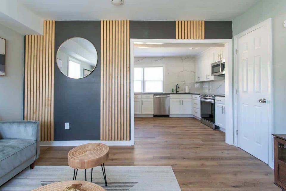 Living Room: Enjoy modern decor and a seamless flow to the kitchen for effortless entertaining!