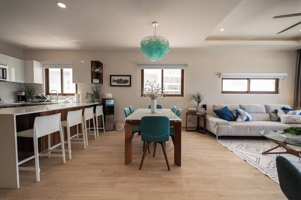 Gather your loved ones around the inviting dining table for laughter-filled meals, or enjoy casual chats at the breakfast bar with refreshing drinks.