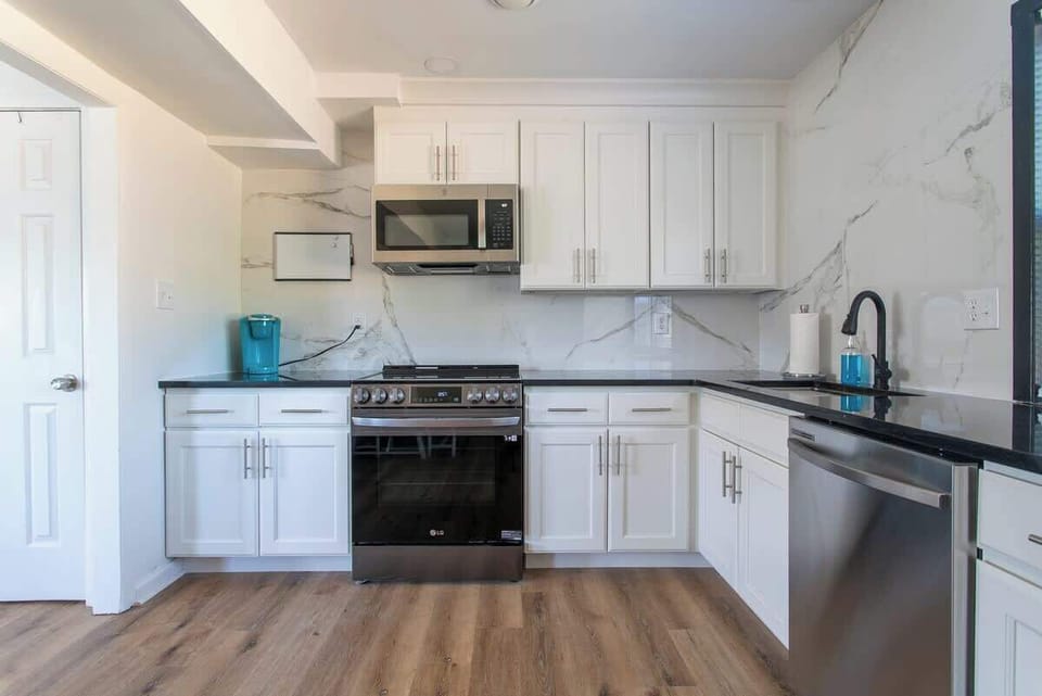 Kitchen: Modern appliances and sleek countertops make cooking a delight in this bright space!