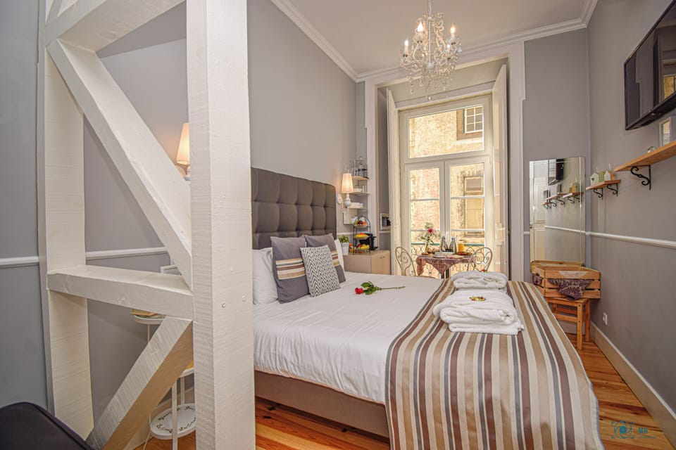 Superior Suite, Balcony, City View | Minibar, in-room safe, soundproofing, iron/ironing board