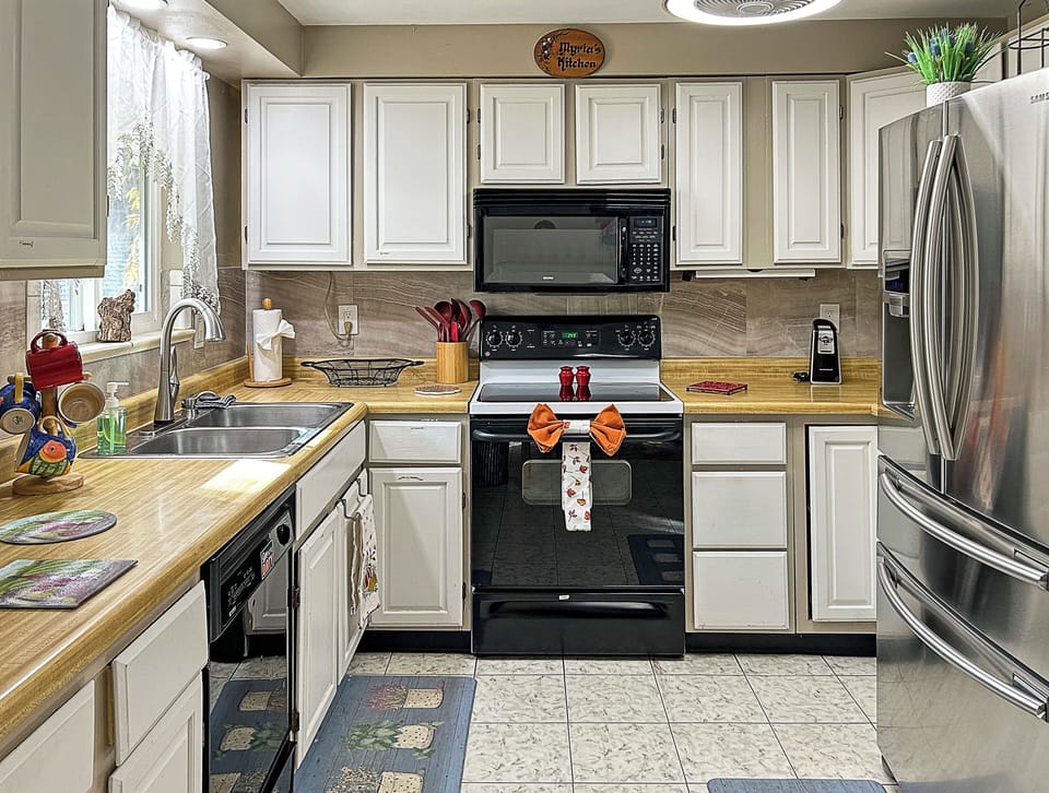Warm wood kitchen with modern appliances and homey comfort.