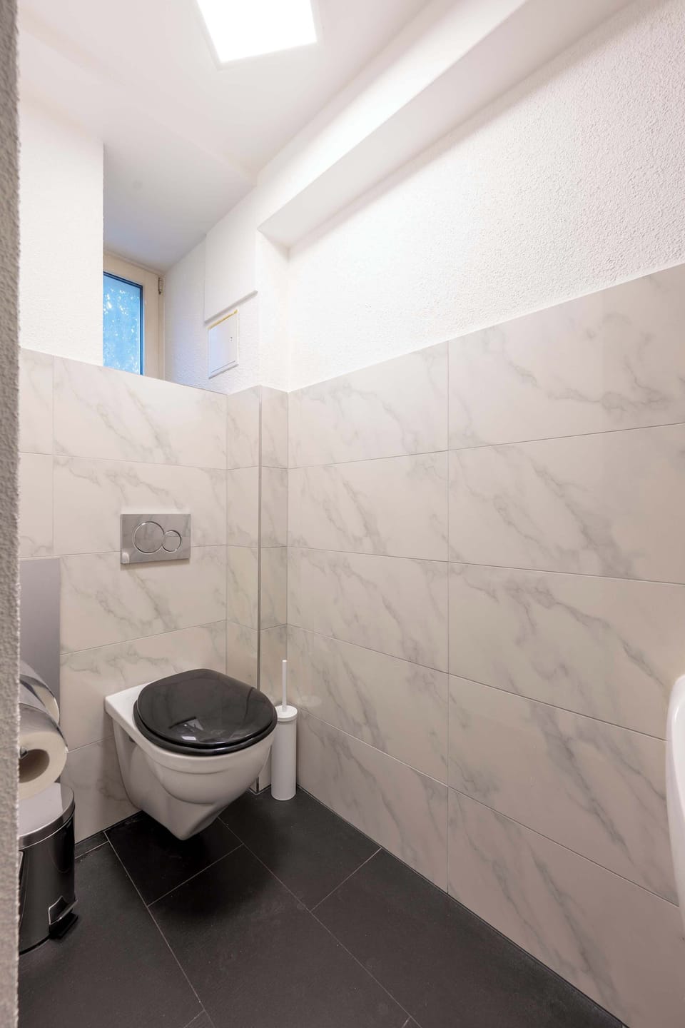 One of two shared toilets in the hallway
