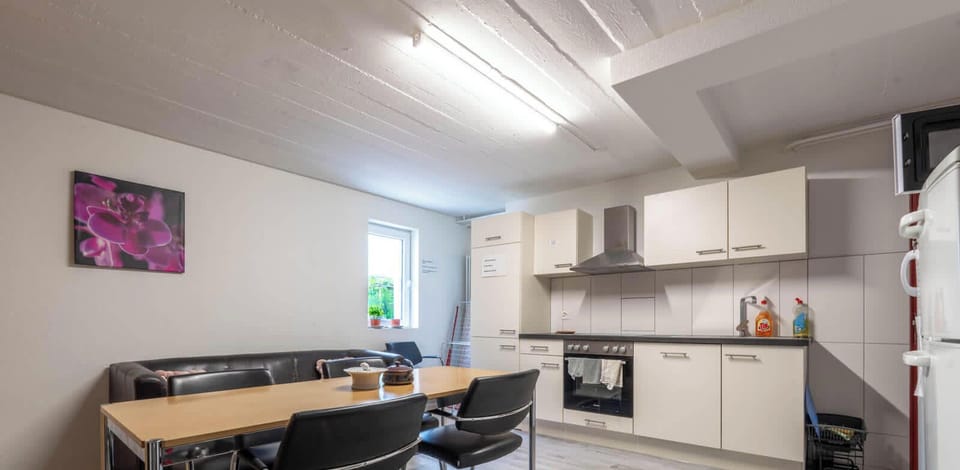 Fully equipped shared kitchen with dining area