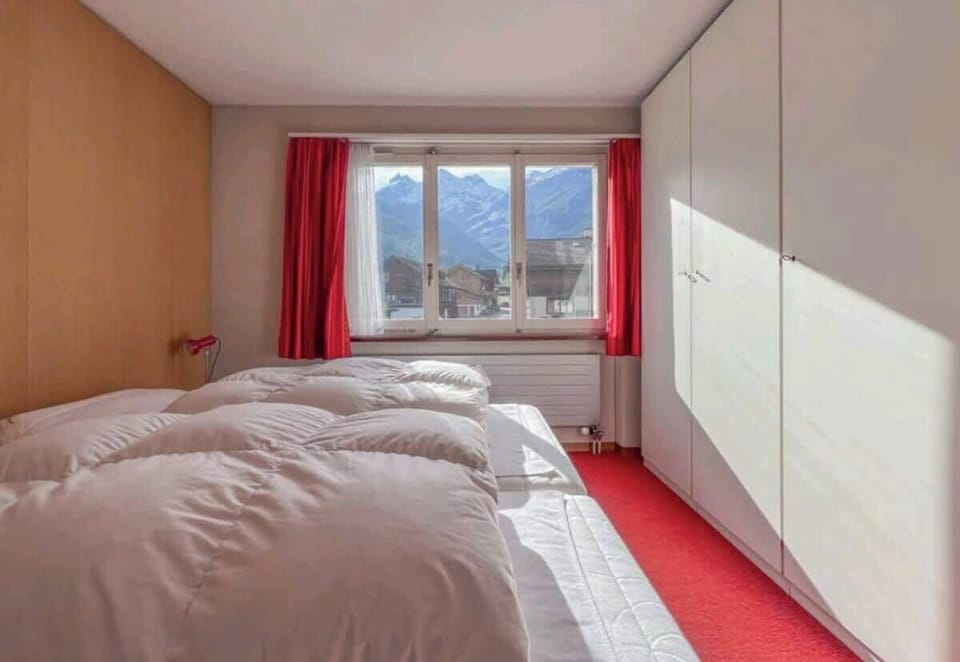 Bright bedroom with mountain views