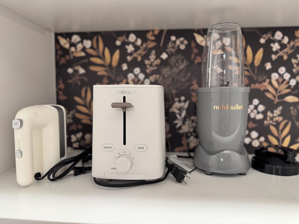crockpot, mixer, toaster, microwave, and smoothie mixer provided