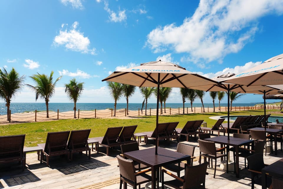 On the beach, white sand, sun loungers, beach umbrellas
