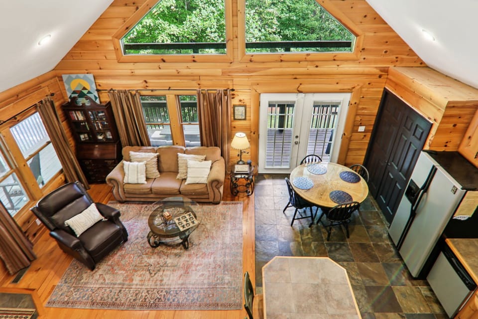 Upstairs loft looking down to the main area of the cabin