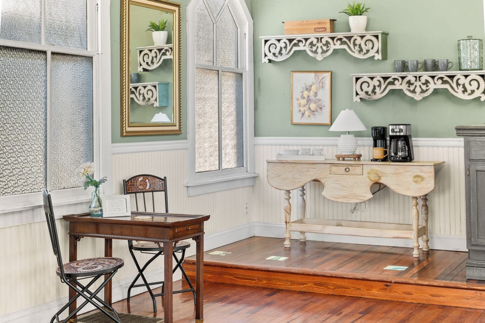 Cozy, dedicated coffee nook with a small table and charming decor.