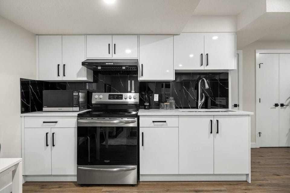 Full kitchen with a drip coffee maker, blender and an instant pot.