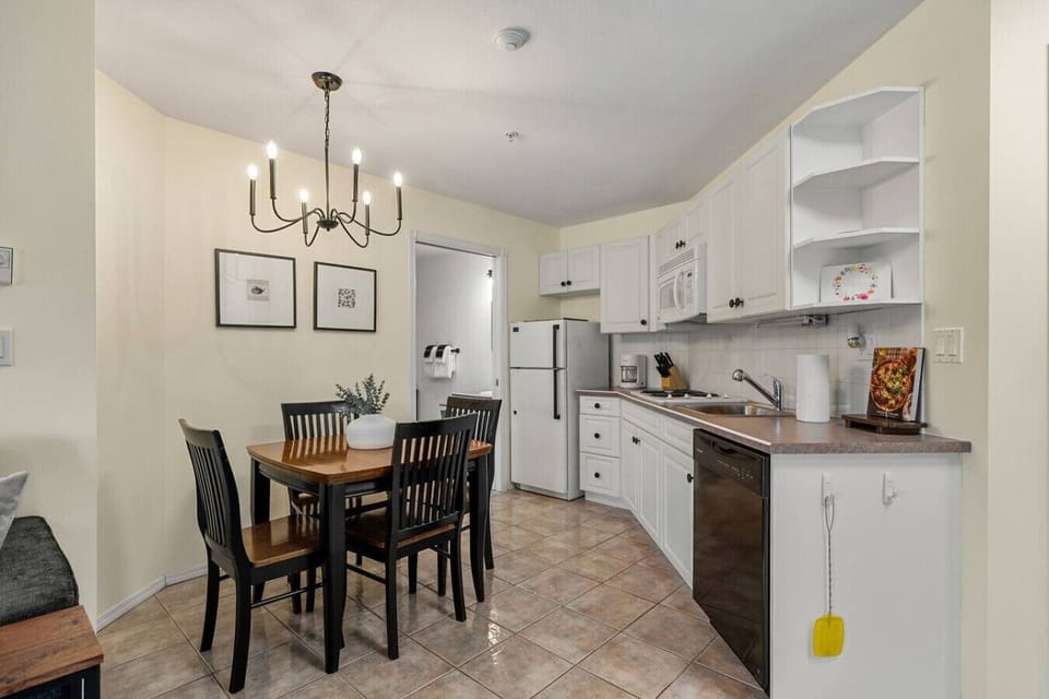 Kitchenette with a fridge, microwave, stove top, drip coffee maker, dishwasher and a toaster oven. Please note that this unit does not have a conventional oven.