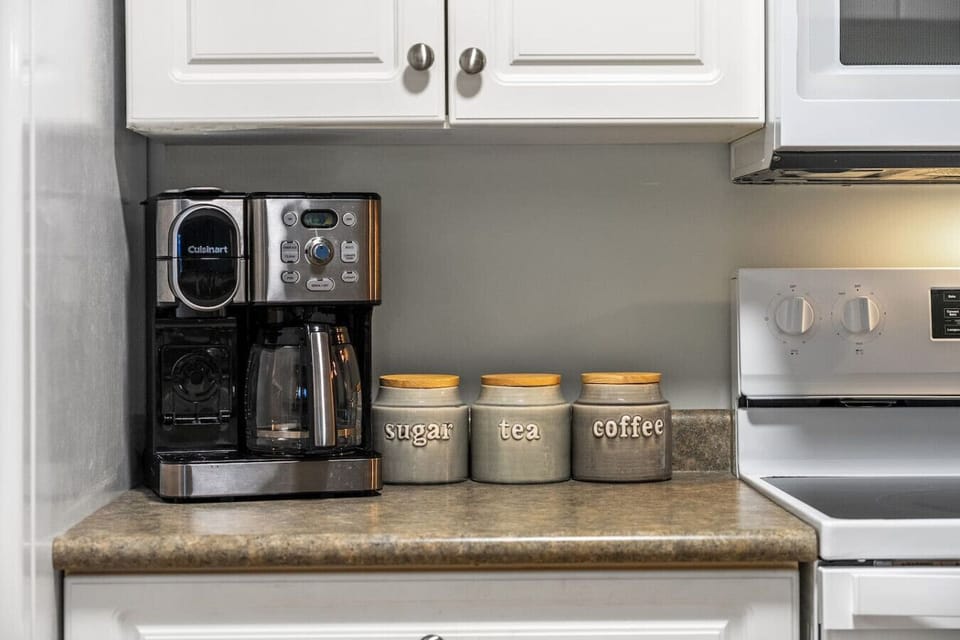 Full kitchen with a drip & Keurig coffee machine, blender, instant pot, slow cooker, rice cooker and a hand mixer.