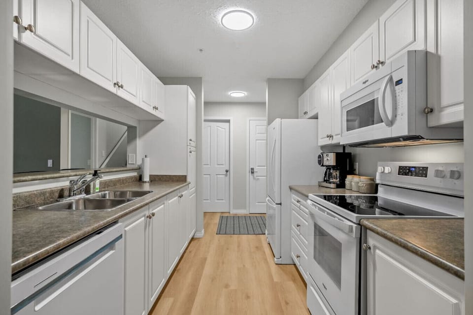Full kitchen with a drip & Keurig coffee machine, blender, instant pot, slow cooker, rice cooker and a hand mixer.