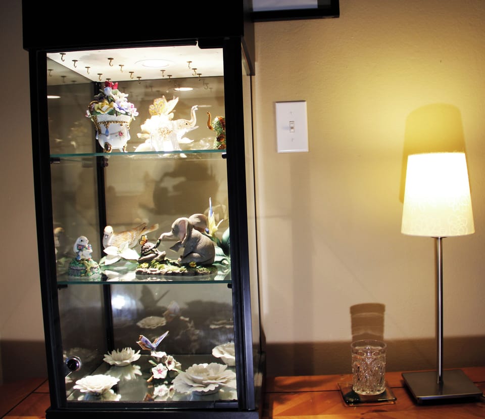 Lighted curio cabinet with rare-to-find crystal and ceramic arts.  