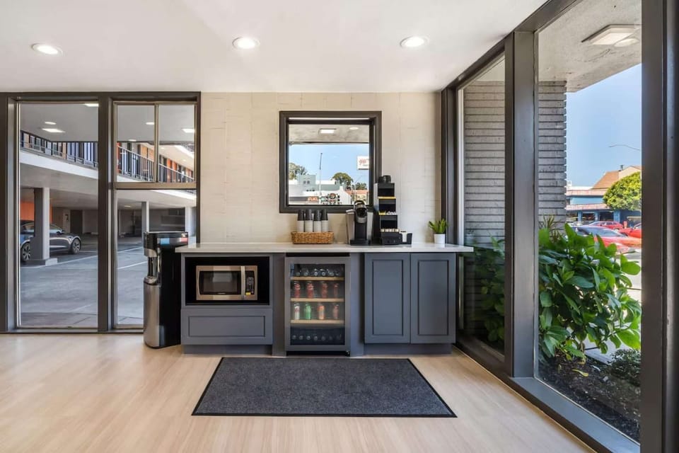 Small refreshment area with microwave and glass-front fridge