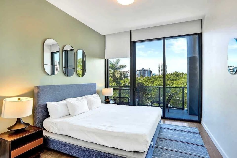 Third bedroom with balcony and decorative mirrors