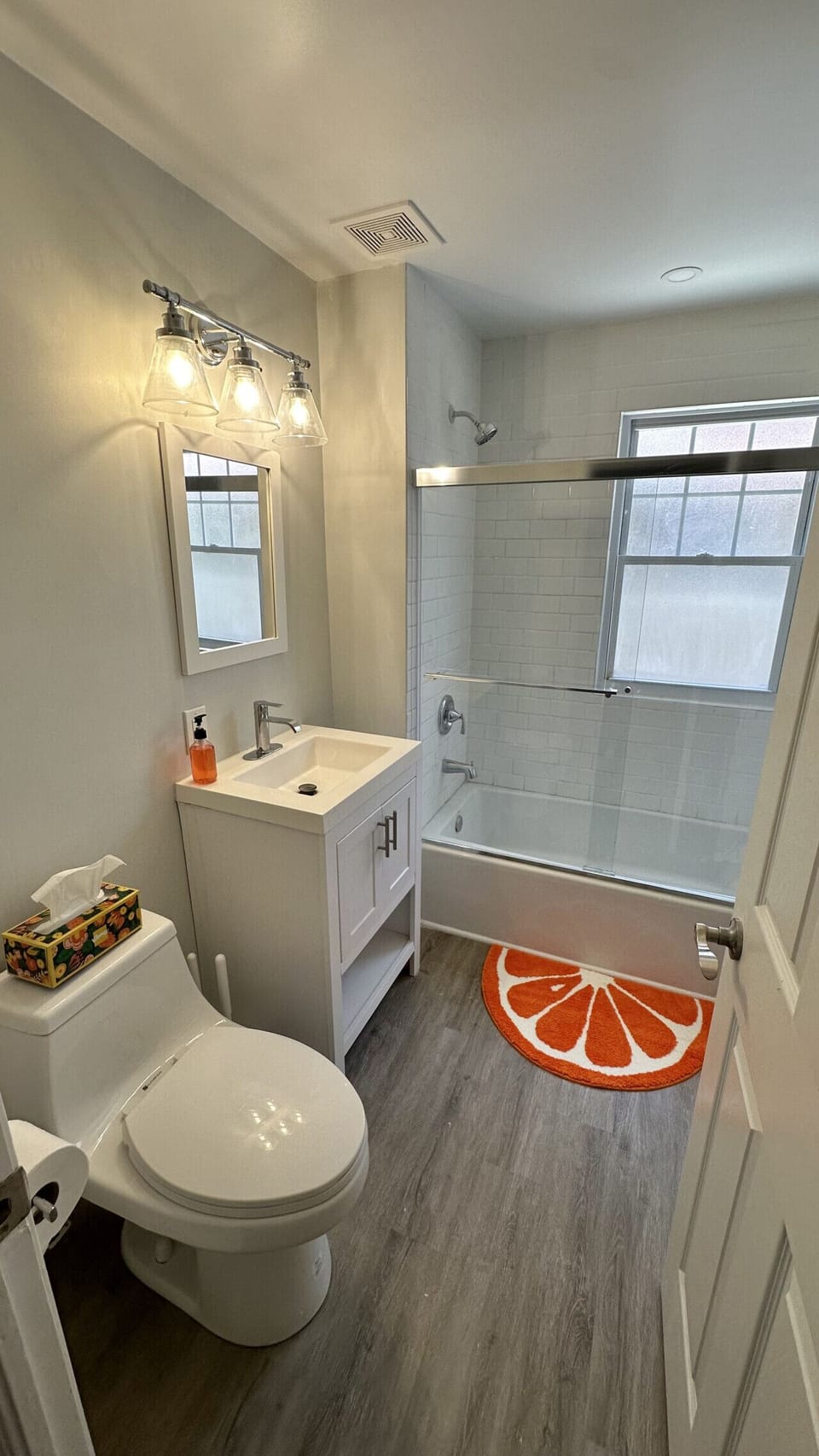Modern full bathroom with a spacious walk-in shower, fresh towels, complimentary toiletries, and everything you need for a comfortable stay.
