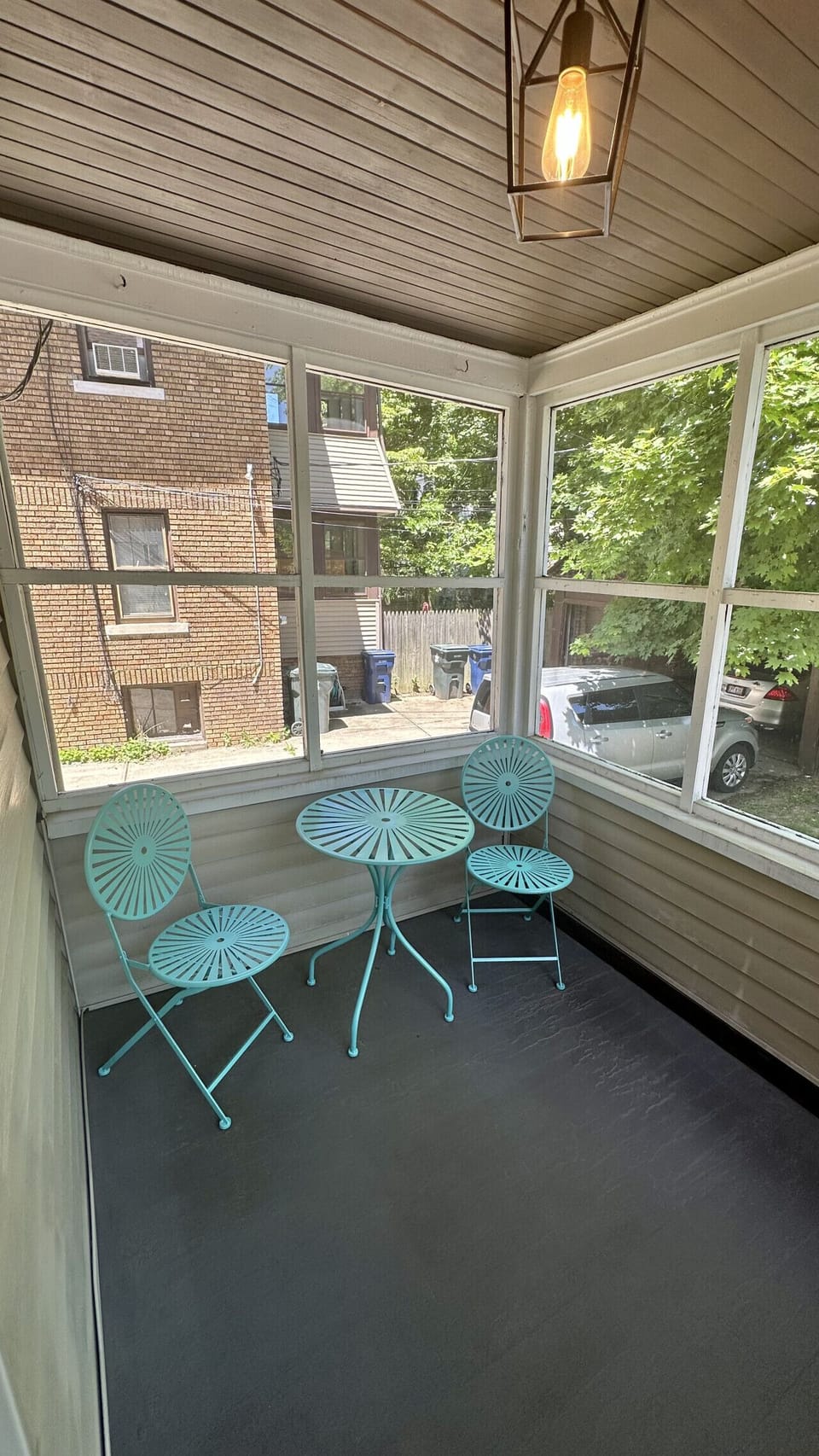 Enjoy your morning coffee or unwind with a book in the private enclosed sunroom, a bright and peaceful space with comfortable seating.