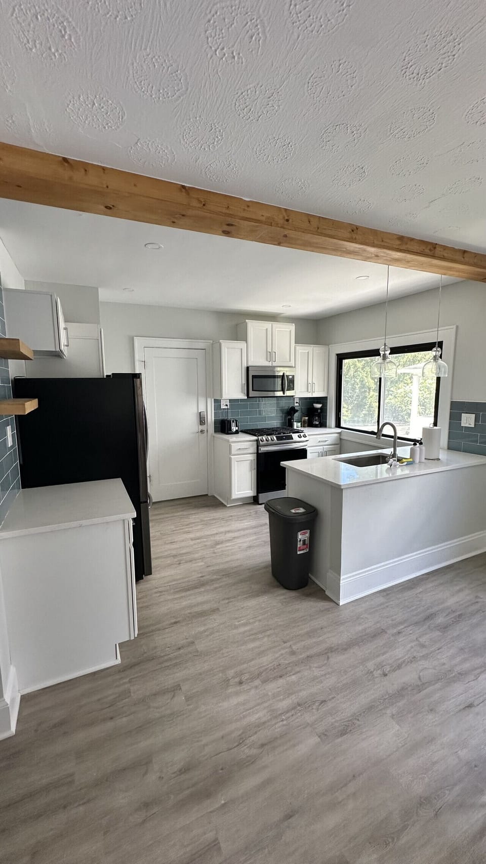 The fully equipped kitchen features full-size appliances, generous counter space, and everything you need to prepare meals throughout your stay.