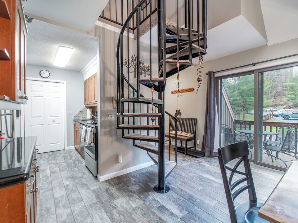 Spacious gathering area leads to patio & kitchen equipped with it all. 