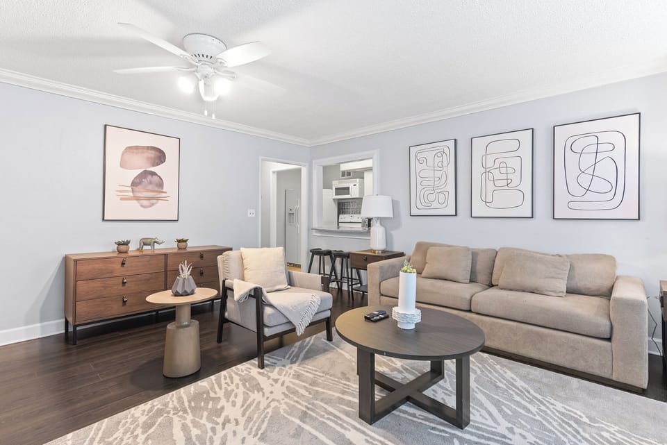 Spacious living room with plenty of natural light! 