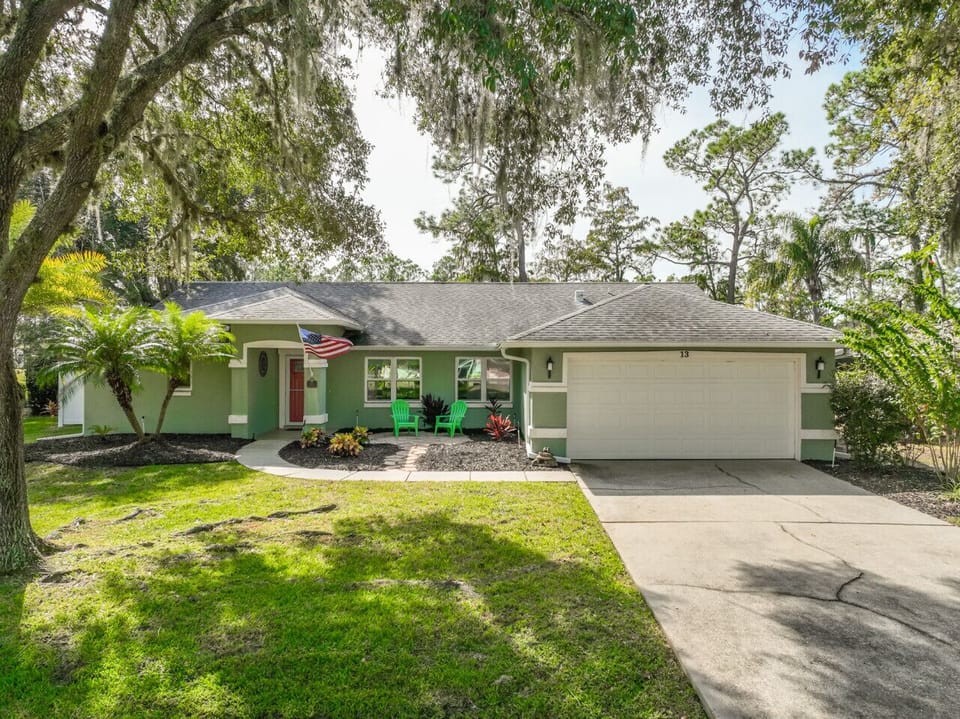 Peaceful Palm Coast home tucked beside Pine Lakes Golf Course