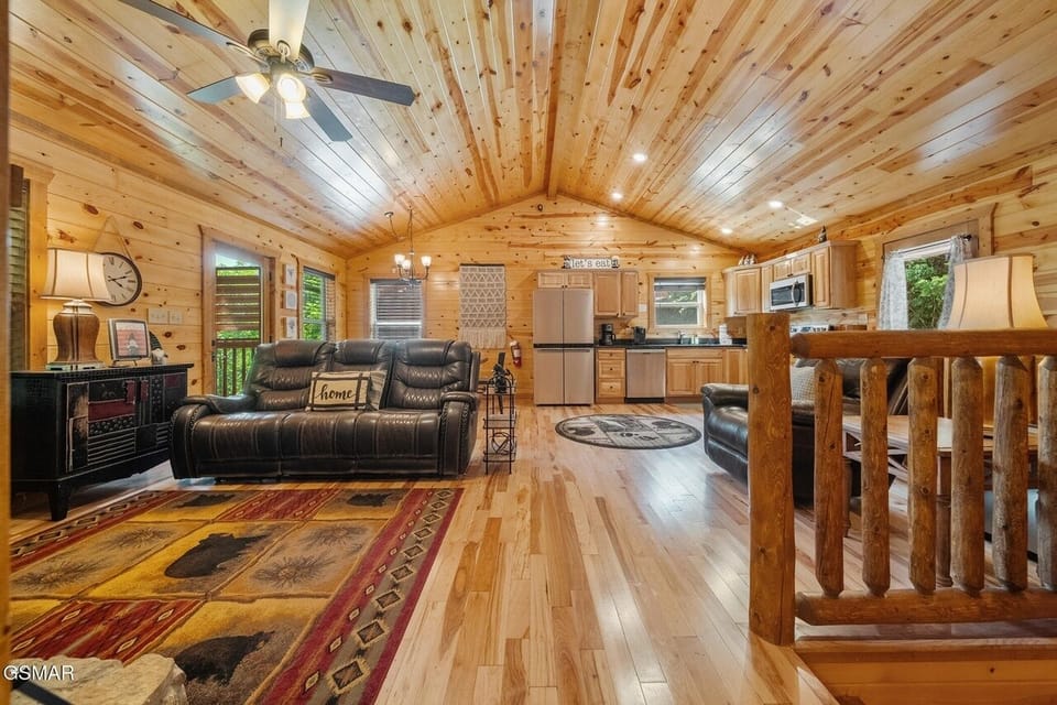 Living Room with a view of Kitchen and the Dining Area is behind the sofa