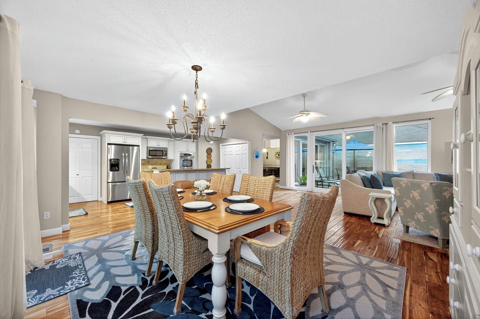 The open layout seamlessly overlooks the dining area with seating for six
