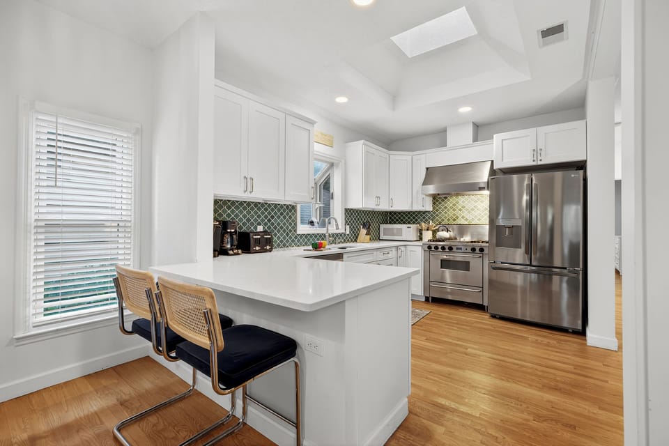 The attached kitchen island provides additional seating for 2.